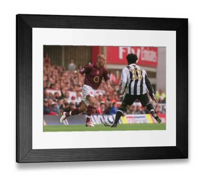 Framed Print : Arsenal's Ljungberg and Babayaro Clash in FA Premier League Showdown: Arsenal 2-0 Newcastle United at Highbury, 2005