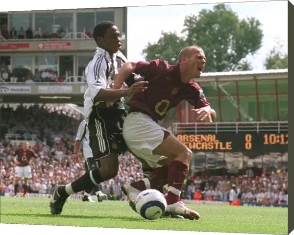 Freddie Ljungberg (Arsenal) is fouled by Charles N Zogbia (Newcastle) in the penalty area