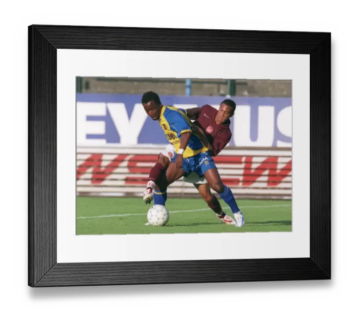 Framed Print : Gael Clichy (Arsenal) Kipre Constant (Beveren). Beveren 3: 3 Arsenal