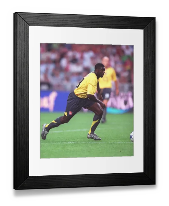 Framed Print : Arsenal's Triumph: Kolo Toure Leads the Way in Arsenal's 1-0 Victory over Ajax at the Amsterdam Tournament, 2005 Framed Print : Arsenal's Triumph: Kolo Toure Leads the Way in Arsenal's 1-0 Victory over Ajax at the Amsterdam Tournament, 2005