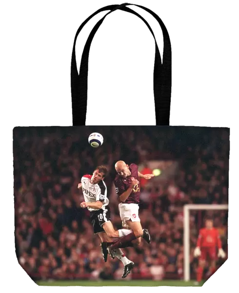 Pascal Cygan (Arsenal) Brian McBride (Fulham). Arsenal 4: 1 Fulham
