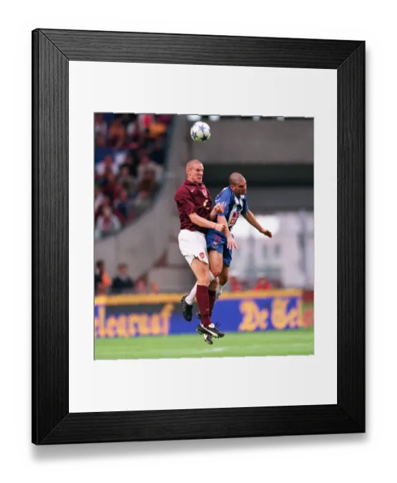 Framed Print : Philippe Senderos (Arsenal) Lisandro (Porto). Arsenal 2: 1 Porto