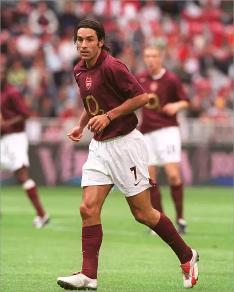 Thrilling Victory: Robert Pires Scores the Winning Goal for Arsenal at Amsterdam Tournament, 2005