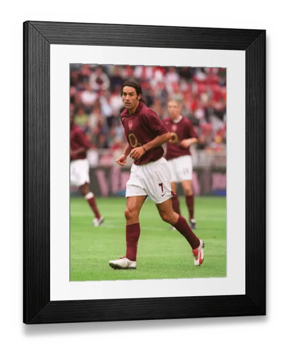 Framed Print : Thrilling Victory: Robert Pires Scores the Winning Goal for Arsenal at Amsterdam Tournament, 2005