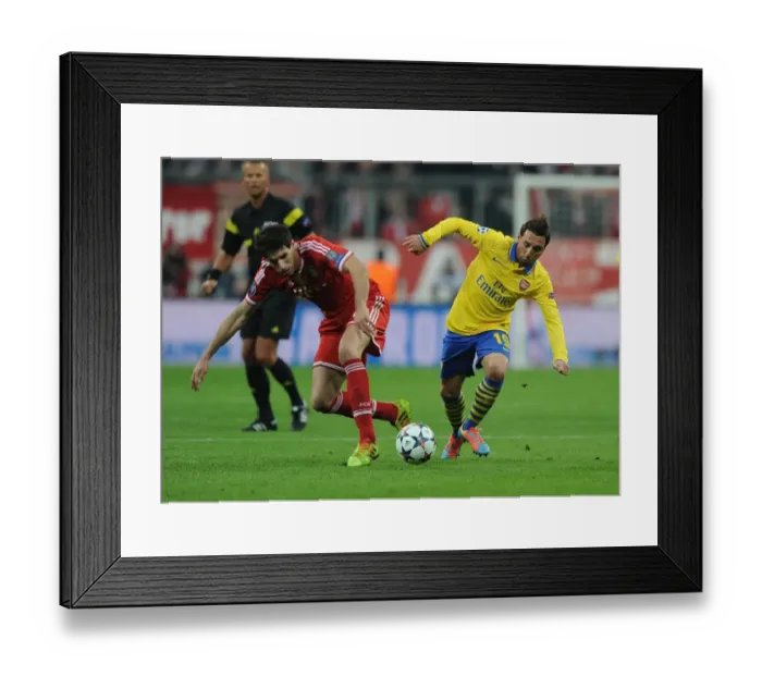 Framed Print : Santi Cazorla vs. Javi Martinez: Battle in the Midfield - Arsenal vs. Bayern Munich, UEFA Champions League 2014 Framed Print : Santi Cazorla vs. Javi Martinez: Battle in the Midfield - Arsenal vs. Bayern Munich, UEFA Champions League 2014