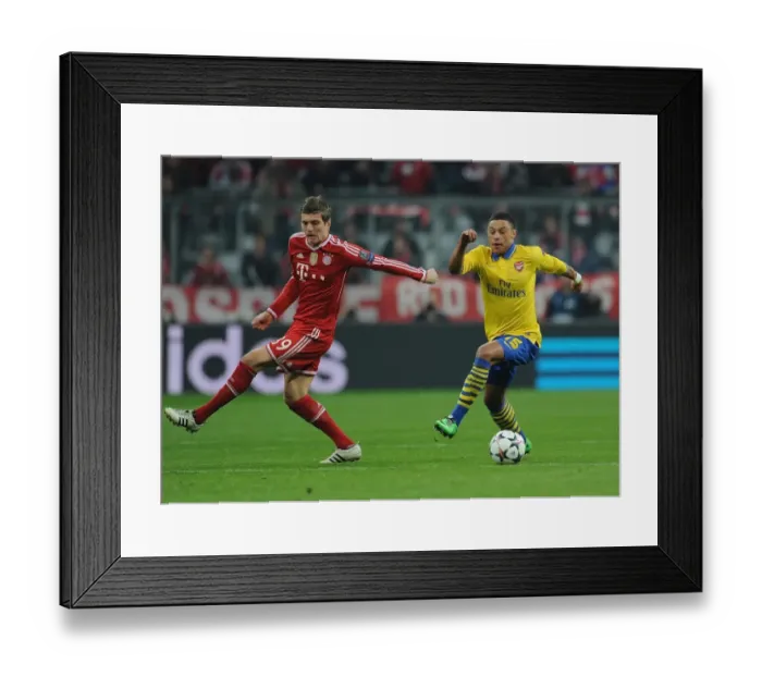 Framed Print : Alex Oxlade-Chamberlain vs Toni Kroos: Battle in the UEFA Champions League between Bayern Munich and Arsenal Framed Print : Alex Oxlade-Chamberlain vs Toni Kroos: Battle in the UEFA Champions League between Bayern Munich and Arsenal