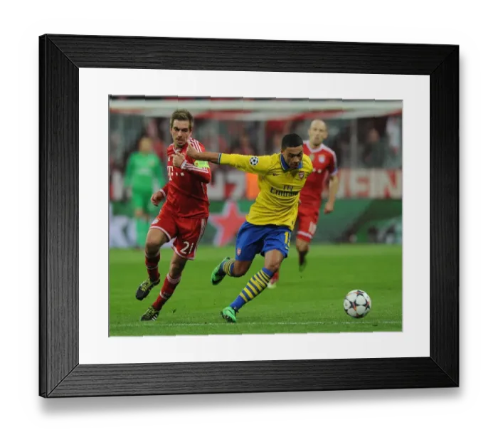Framed Print : Alex Oxlade-Chamberlain vs. Philipp Lahm: Battle at the Allianz Arena - Arsenal vs. Bayern Munich, UEFA Champions League 2014