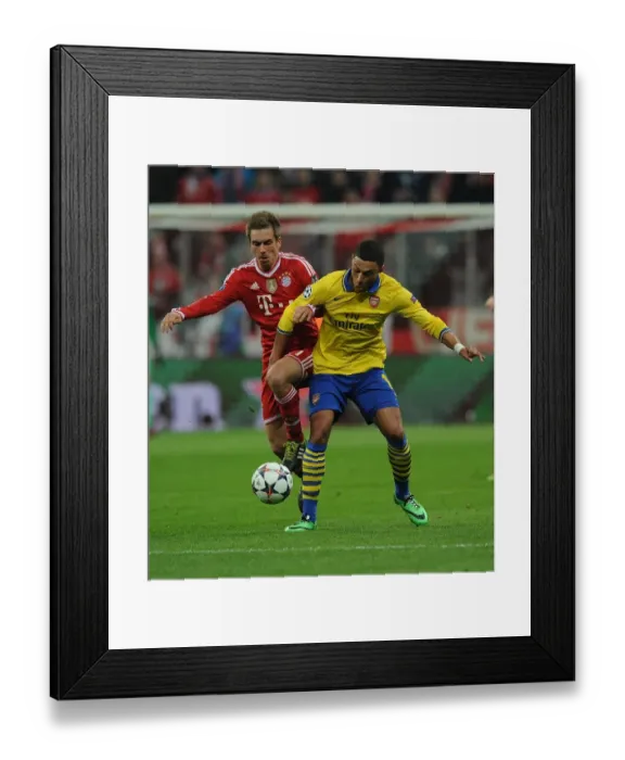 Framed Print : Battle of the Midfield: Oxlade-Chamberlain vs. Lahm - Arsenal's Ox Takes on Bayern's Maestro in the UEFA Champions League