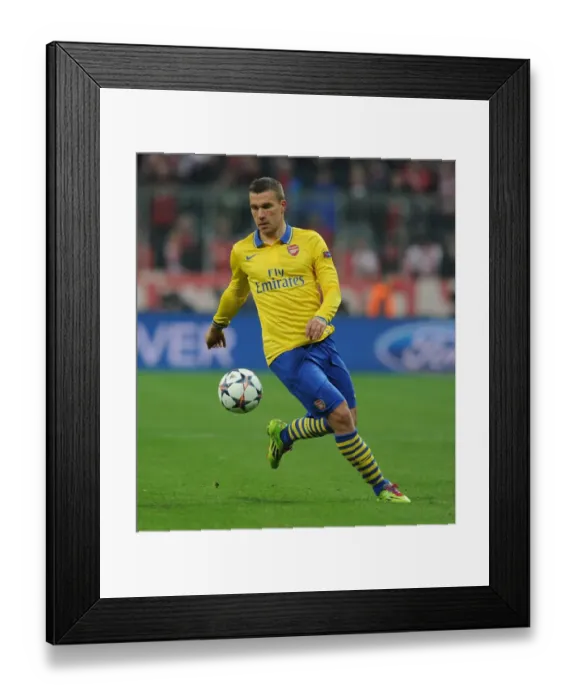 Framed Print : Lukas Podolski: Battle at the Allianz Arena - FC Bayern Munich vs Arsenal, UEFA Champions League 2014