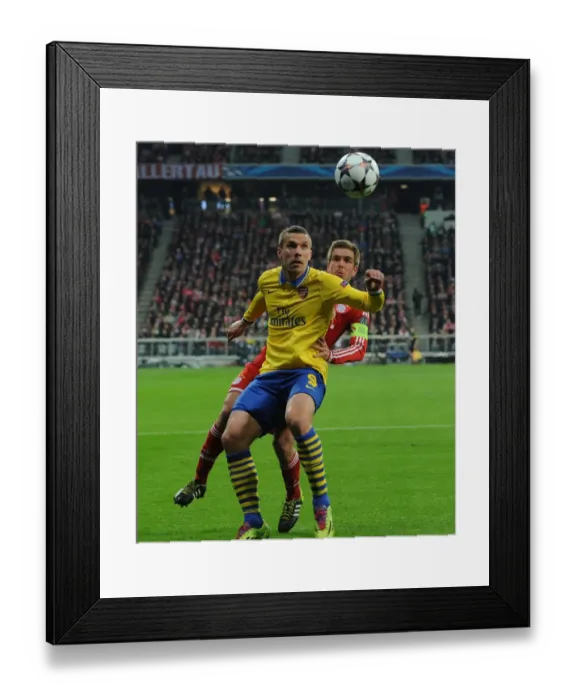 Framed Print : Lukas Podolski vs. Philippe Lahm: A Battle in the UEFA Champions League Round of 16 Framed Print : Lukas Podolski vs. Philippe Lahm: A Battle in the UEFA Champions League Round of 16