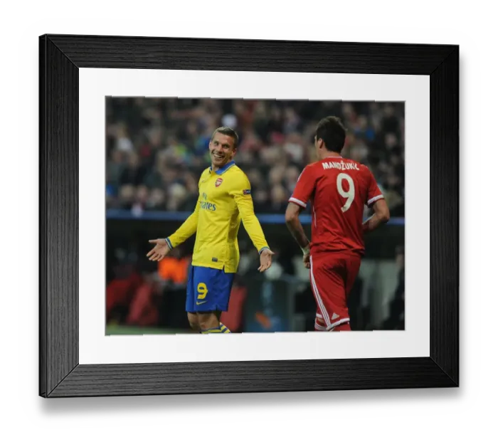 Framed Print : Lukas Podolski and Mario Mandzukic Share a Light-Hearted Moment Amidst UEFA Champions League Rivalry Framed Print : Lukas Podolski and Mario Mandzukic Share a Light-Hearted Moment Amidst UEFA Champions League Rivalry