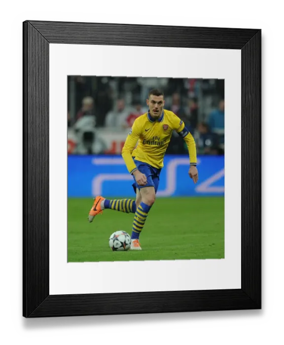 Framed Print : Thomas Vermaelen's Determined Performance in Arsenal's UEFA Champions League Battle at Allianz Arena (2013-14)