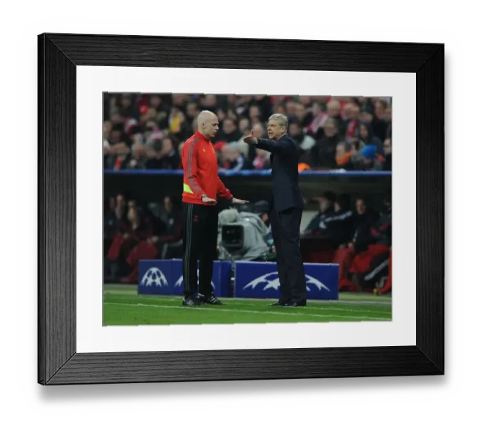 Framed Print : Arsene Wenger's Tense Clash with Referees during Arsenal's UEFA Champions League Match at Bayern Munich (2013-14)