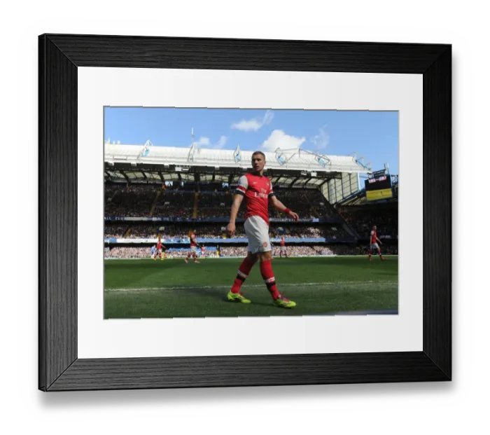 Framed Print : Lukas Podolski Faces Off Against Chelsea: Premier League Showdown (2013-14) Framed Print : Lukas Podolski Faces Off Against Chelsea: Premier League Showdown (2013-14)