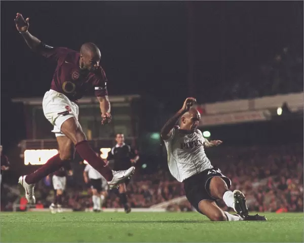 Thierry Henry scores Arsenals 2nd goal past Zesh Rehman (Fulham)