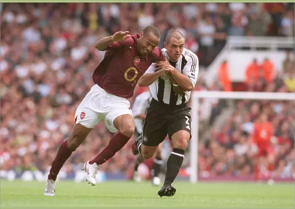 Thierry Henry (Arsenal) Stephen Carr (Newcastle). Arsenal 2: 0 Newcastle United