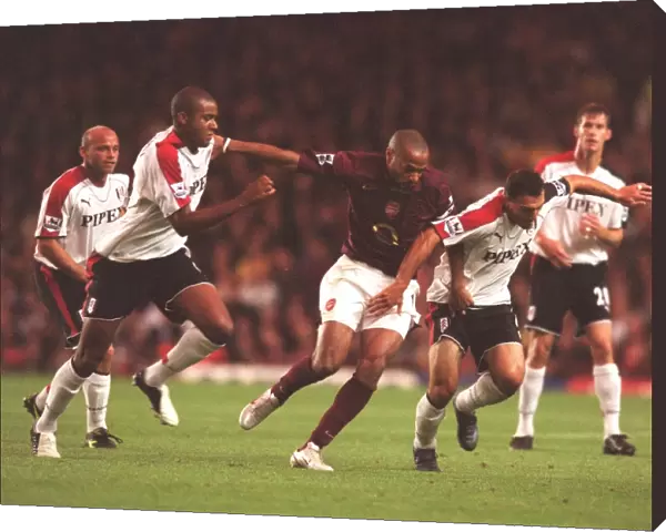 Thierry Henry (Arsenal) Zat Knight and Moritz Volz (Fulham). Arsenal 4: 1 Fulham