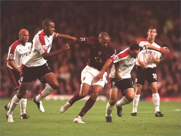 Thierry Henry (Arsenal) Zat Knight and Moritz Volz (Fulham). Arsenal 4: 1 Fulham