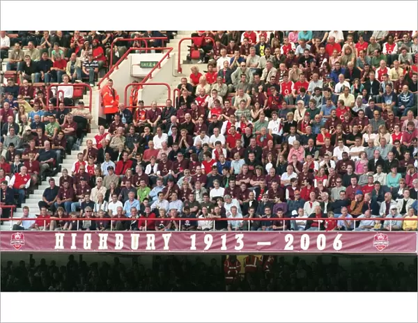 Fans in the North Bank sit above the 1913 - 2006 banner