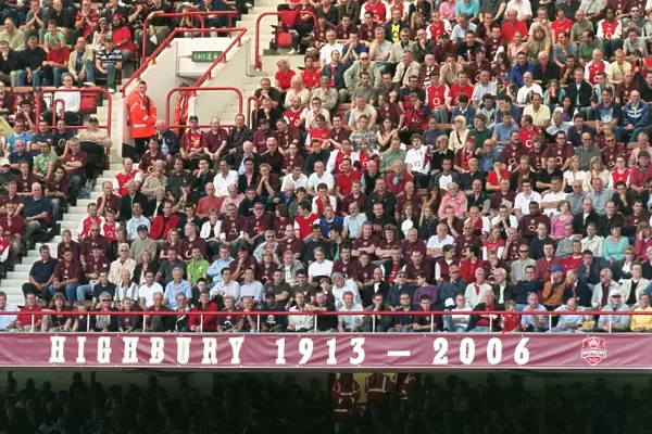 Fans in the North Bank sit above the 1913 - 2006 banner