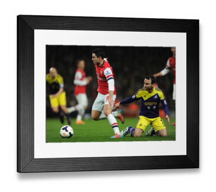 Framed Print : Intense Rivalry: Mikel Arteta vs. Leon Britton Battle at Arsenal's Emirates Stadium (Arsenal v Swansea City, Premier League 2013-14)