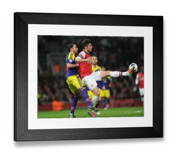 Framed Print : Arsenal's Olivier Giroud Fends Off Swansea's Chico Flores in Premier League Clash
