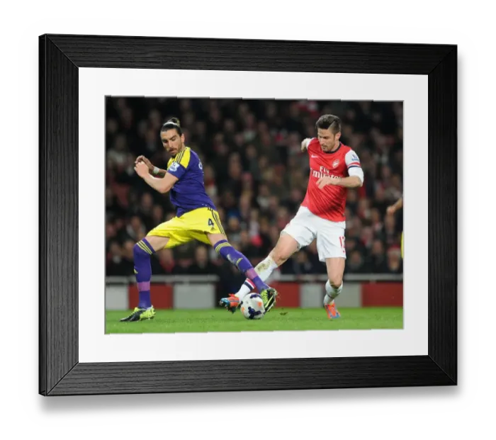 Framed Print : Clash at Emirates: Giroud vs. Flores, Arsenal vs. Swansea City, Premier League 2013-14