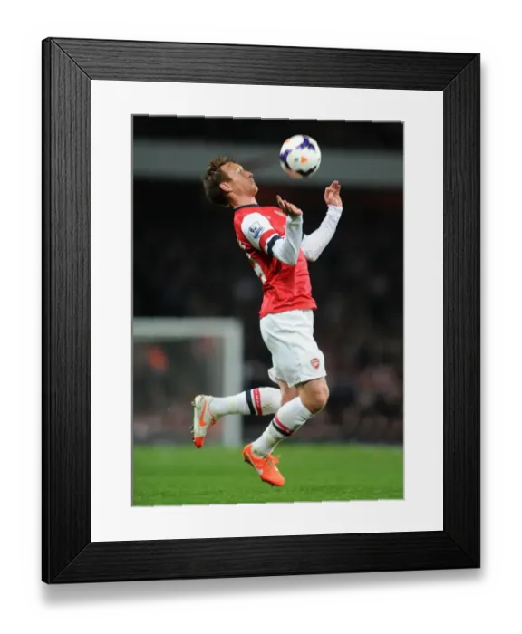 Framed Print : Arsenal's Kim Kallstrom in Action against Swansea City (2013-14)