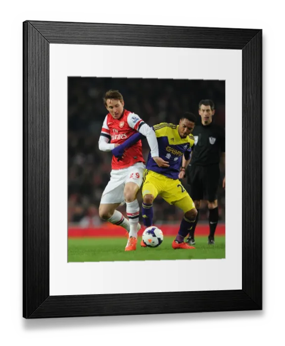 Framed Print : Arsenal vs Swansea: Intense Battle between Kim Kallstrom and Jonathan De Guzman