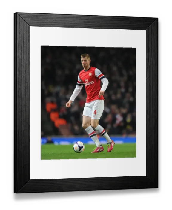 Framed Print : Per Mertesacker (Arsenal). Arsenal 2: 2 Swansea City. Barclays Premier League. Emirates Stadium Framed Print : Per Mertesacker (Arsenal). Arsenal 2: 2 Swansea City. Barclays Premier League. Emirates Stadium