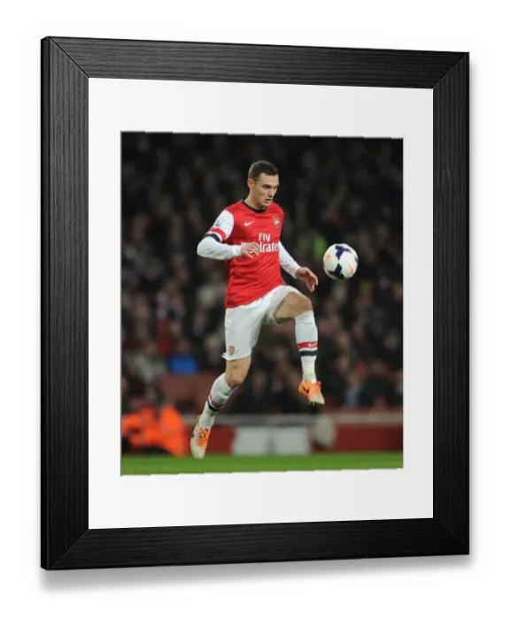 Framed Print : Thomas Vermaelen Focuses in Arsenal's Clash Against Swansea City (Arsenal v Swansea City 2013-14)