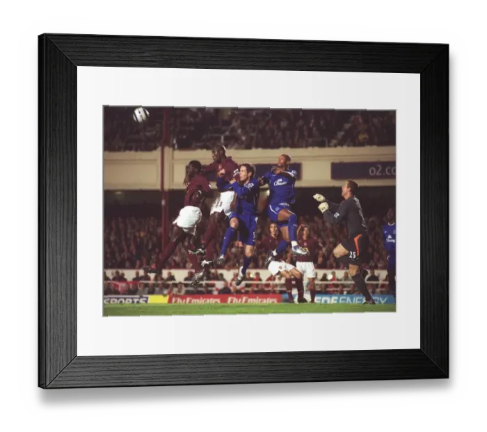 Framed Print : Campbell. Sol Campbell out jumps David Weir and Marcus Bent 