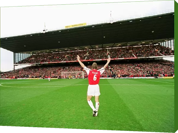 Captain Tony Adams salutes the North Bank before his 500th league match for Arsenal