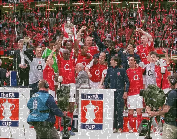 The Arsenal Players celebrate winning the FA Cup Trophy