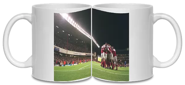 The Arsenal players celebrate Robert Pires 2nd goal in front of the East Stand