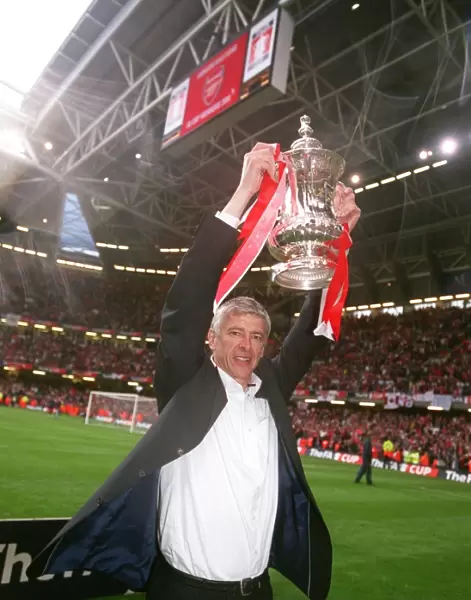 Arsene Wenger the Arsenal Manager with the FA Cup Trophy