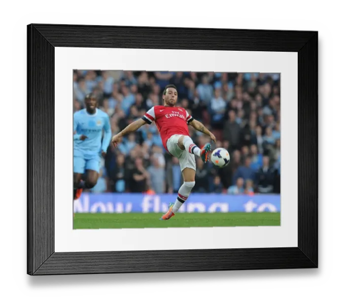 Framed Print : Santi Cazorla in Action: Arsenal vs Manchester City, Premier League 2013 / 14 Framed Print : Santi Cazorla in Action: Arsenal vs Manchester City, Premier League 2013 / 14