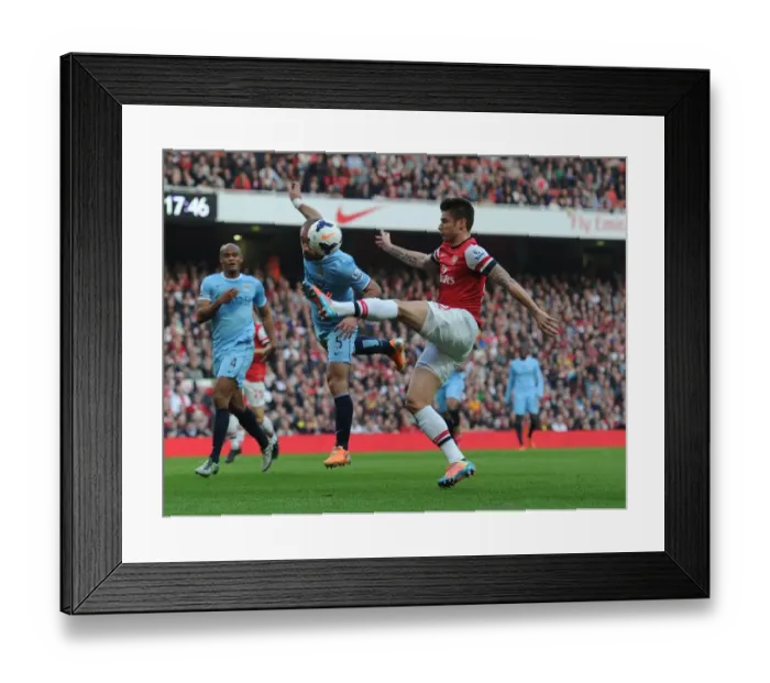 Framed Print : Giroud vs. Zabaleta: A Premier League Battle at the Emirates