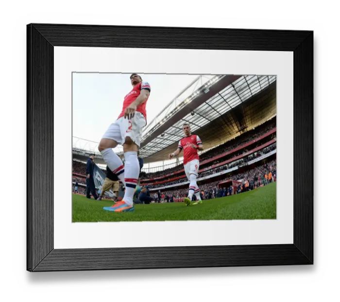Framed Print : Arsenal's Lukas Podolski Gears Up for Arsenal vs Manchester City (2013 / 14)