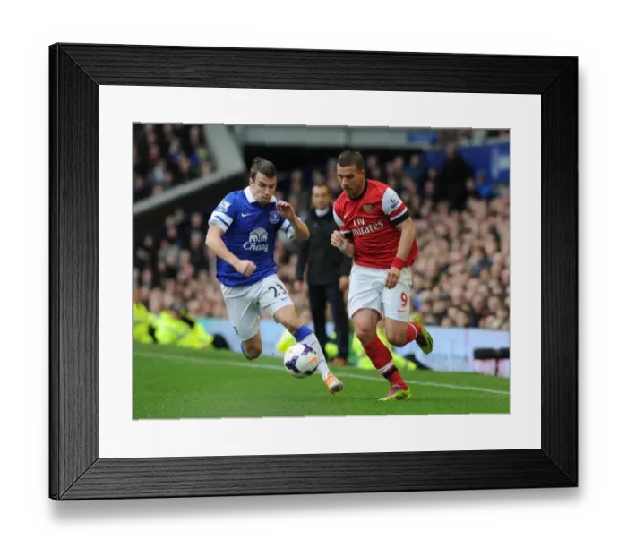 Framed Print : Podolski vs. Coleman: Everton vs. Arsenal, Premier League Showdown