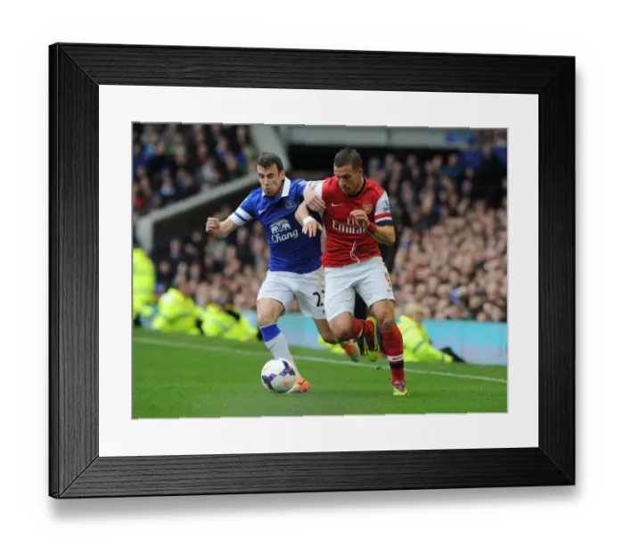 Framed Print : Podolski vs. Coleman: Intense Battle at Goodison Park - Everton vs. Arsenal, Premier League 2013 / 14