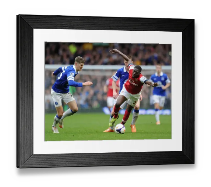 Framed Print : Clash at Goodison Park: Sanogo vs McCarthy & Stones (Everton vs Arsenal, Premier League) Framed Print : Clash at Goodison Park: Sanogo vs McCarthy & Stones (Everton vs Arsenal, Premier League)