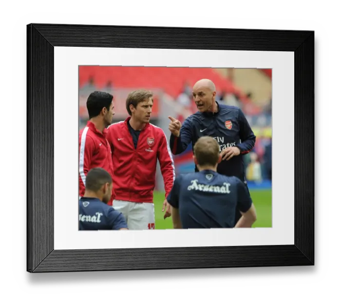 Framed Print : Arsenal Coaches Steve Bould, Nacho Monreal, and Mikel Arteta Discussing Strategy Before FA Cup Semi-Final vs Wigan Athletic Framed Print : Arsenal Coaches Steve Bould, Nacho Monreal, and Mikel Arteta Discussing Strategy Before FA Cup Semi-Final vs Wigan Athletic