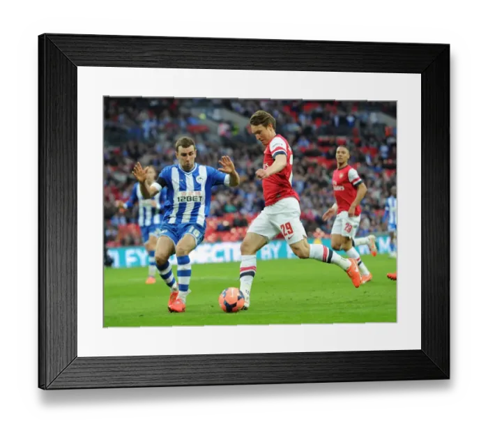 Framed Print : Arsenal's Kim Kallstrom Faces Off Against Wigan's James McArthur in FA Cup Semi-Final Showdown Framed Print : Arsenal's Kim Kallstrom Faces Off Against Wigan's James McArthur in FA Cup Semi-Final Showdown