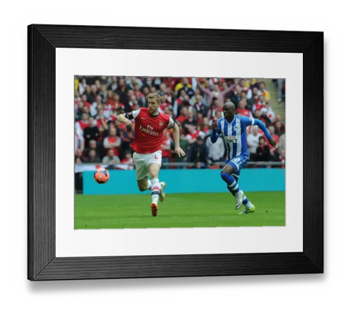 Framed Print : Arsenal's Per Mertesacker Faces Off Against Wigan's Marc-Antoine Fortune in FA Cup Semi-Final Showdown