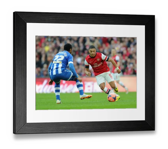 Framed Print : Arsenal's Alex Oxlade-Chamberlain Faces Off Against Wigan's Jean Beausejour in FA Cup Semi-Final Showdown Framed Print : Arsenal's Alex Oxlade-Chamberlain Faces Off Against Wigan's Jean Beausejour in FA Cup Semi-Final Showdown