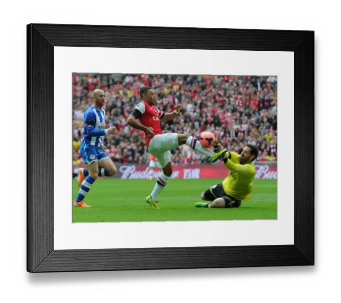 Framed Print : Arsenal's Alex Oxlade-Chamberlain vs. Wigan's Scott Carson: A FA Cup Semi-Final Battle Framed Print : Arsenal's Alex Oxlade-Chamberlain vs. Wigan's Scott Carson: A FA Cup Semi-Final Battle