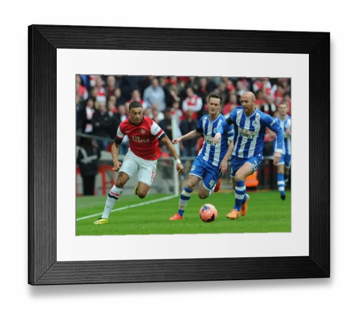 Framed Print : Arsenal's Alex Oxlade-Chamberlain Stands Off Against Wigan's Stephen Crainey and Josh McEachran in FA Cup Semi-Final Clash Framed Print : Arsenal's Alex Oxlade-Chamberlain Stands Off Against Wigan's Stephen Crainey and Josh McEachran in FA Cup Semi-Final Clash