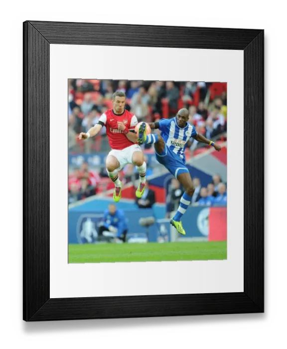 Framed Print : Clash at Wembley: Lukas Podolski vs. Emerson Boyce - FA Cup Semi-Final Showdown Framed Print : Clash at Wembley: Lukas Podolski vs. Emerson Boyce - FA Cup Semi-Final Showdown