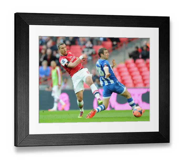 Framed Print : Podolski vs McArthur: Intense Moment at the FA Cup Semi-Final between Arsenal and Wigan Framed Print : Podolski vs McArthur: Intense Moment at the FA Cup Semi-Final between Arsenal and Wigan